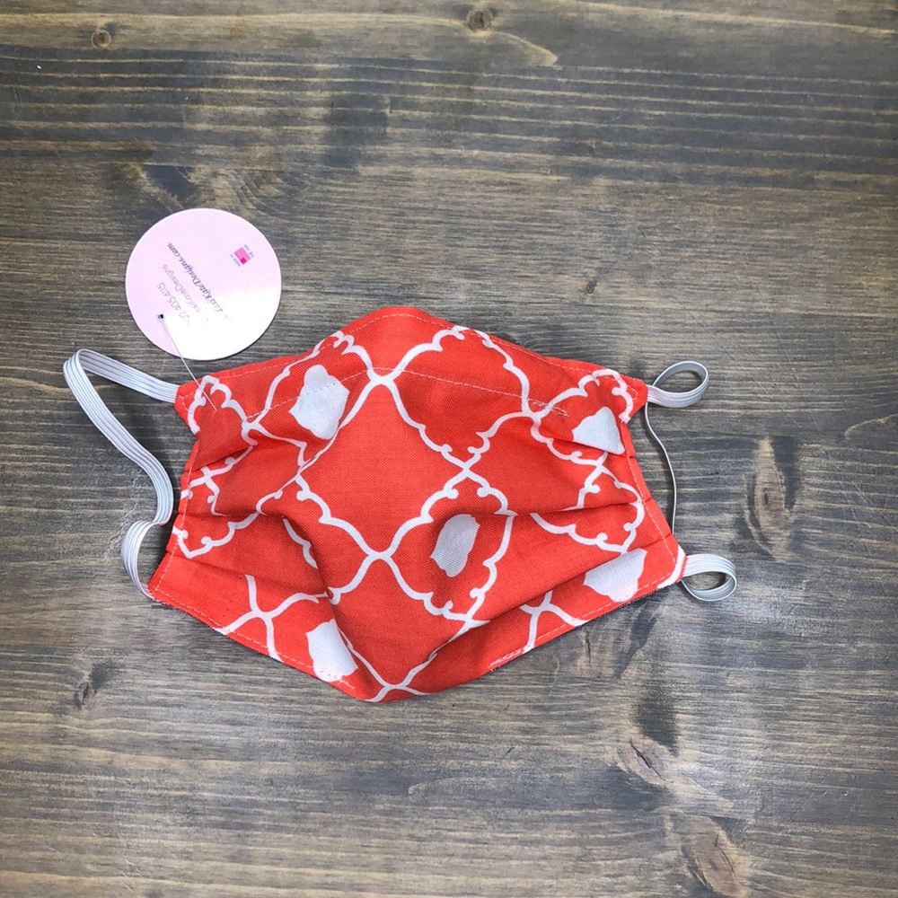 Coral and white face mask